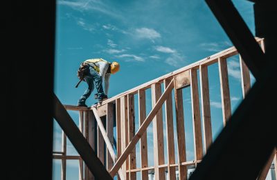 A worker working on an outdoor timber wood project